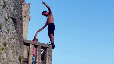Guy's Double Backflip from 25-Meter Castle Balcony