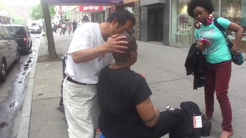 Luodong Massages Bald Black Woman On Sidewalk As Her Girlfriend Watches
