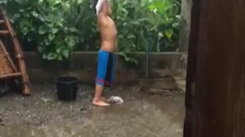My Autism Kid washing clothes playing in the rain
