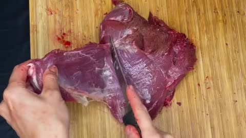 Butchering a deer hindquarter