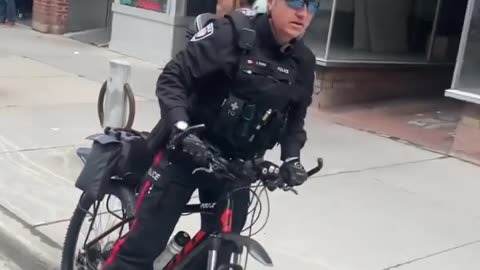 J. IRVING Ottawa Police Bully with a bicycle