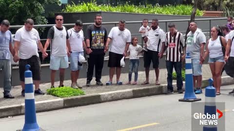 Pelé fans pray for football star outside Brazilian hospital as he receives palliative care