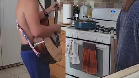 Richie Playing guitar for his mom