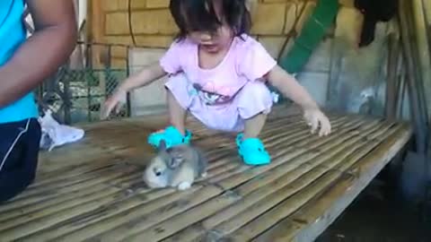 Girl playing with furr friend baby rabbit. 😊