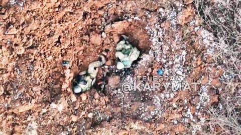 A copter drops a grenade on a Russian soldier somewhere near Bakhmut