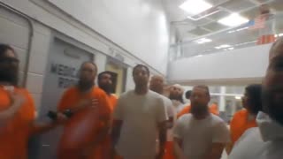 J6 Prisoners Pray and Sing national anthem
