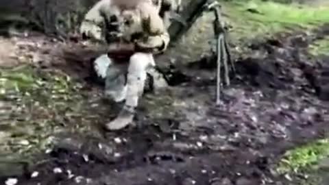 Ukrainian Special Operations Forces members firing a 120mm mortar