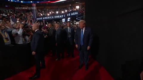 Donald Trump enters the arena on day two of the RNC