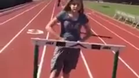 Collab copyright protection - girl in grey over hurdle faceplant
