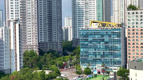 a residential complex with clear skies and high-rise apartments