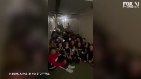 Students sing songs while sheltering from fighting in Kyiv