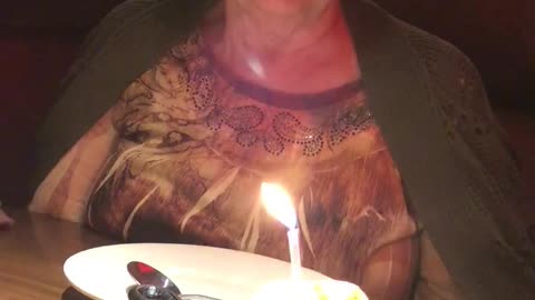 Sweet Grandma Has a Hard Time Blowing Out Candle