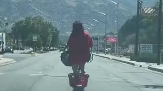Person Scooters Down Roadway