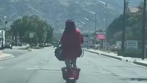 Person Scooters Down Roadway