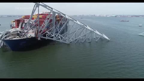 Baltimore bridge collapses after powerless cargo ship rams into support column