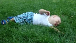 the child enjoys the thick grass.