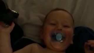 Toddler giggles after bath time.