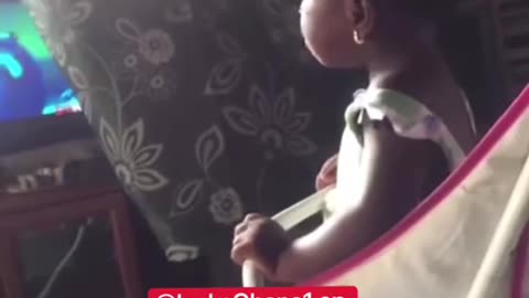 Hilarious as a 3 year African girls frowns at mum and then watches television