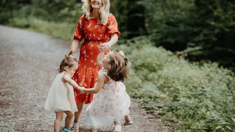 woman and 2 girls playing outdoor