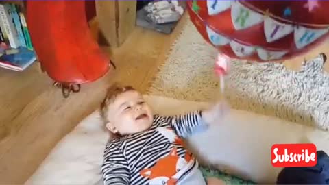 Baby Laughs at the Balloons