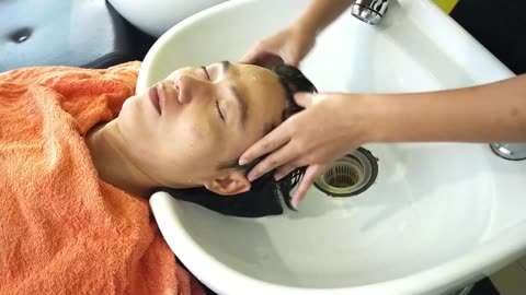 Beautiful girl in Lee hair salon helps me wash my hair and give me a great facial massage