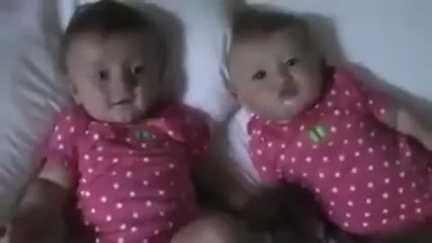 Very cute baby bursts out laughing and pulls smiles from all of us.