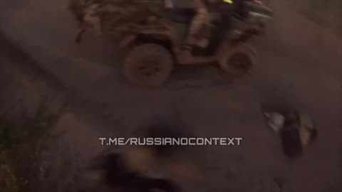 Russian soldier driving on an ATV with his squad has close call with fpv drone