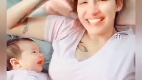 Adorable baby looking at her mom Love