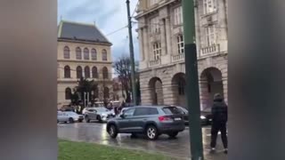 People cling to Prague building during mass shooting