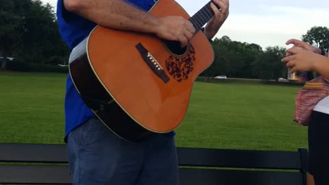 Playing music at the lake on a summer's Eve