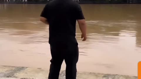 "Epic Fail: Man's Attempt to Kick Cane Ends with Shoe in the River!"