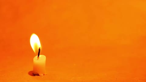 A candle flame with background music