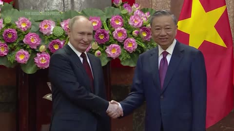 Russia's Vladimir Putin greeted by Vietnamese President To Lam