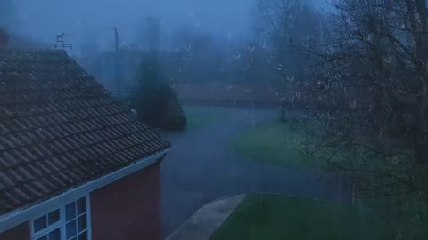 Heavy Rainstorm and rumble thunder on the tile roof at night