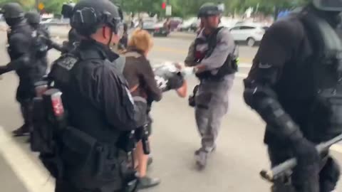 Aug 17 2019 Portland 1.7.3 older couple limp out of the mob with police help