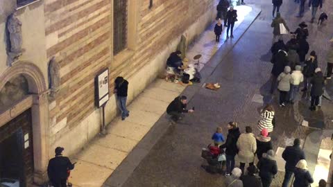Verona Bucket Street Musician Draws Crowds