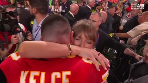 Taylor Swift and Travis Kelce celebrating the Chiefs Super Bowl win on the field
