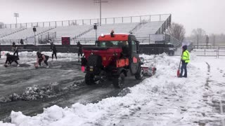 November 12, 2022 - 12:12 PM: Clearing Snow from the Field Before the Monon Bell Classic
