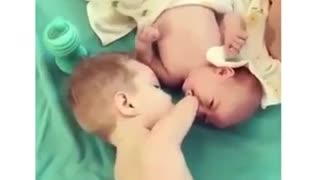 Disabled Toddler Helps Brother