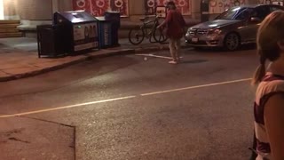 Street guy can't throw water bottle into trash
