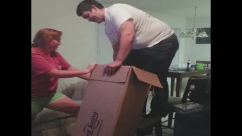 Man tries to squeeze into a box