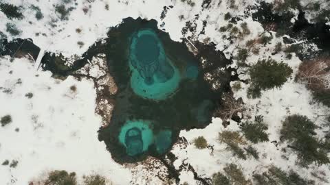 Turquoise lake in winter landscape