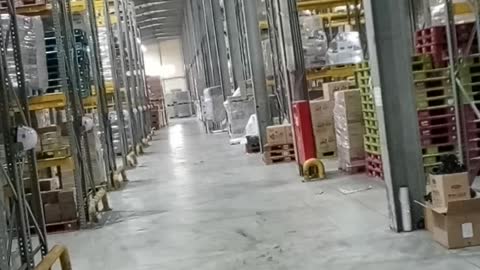 Reverse with a forklift in a warehouse