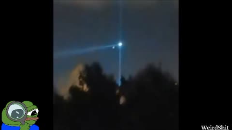 Watch As UFO Shoots A Green Laser Into The Sky