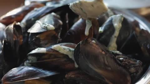 Clams Cooking While A Sauce Is Tossed