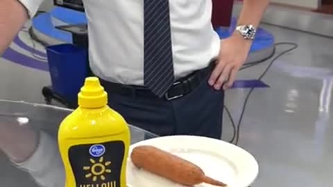 Good Day anchor tries his first corn dog