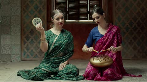 Hindu stylish women playing music