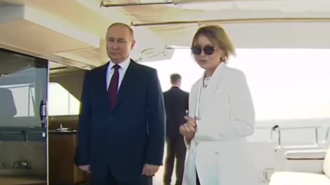 Russian President Vladimir Putin was captured on video gesturing a talkative host not to speak