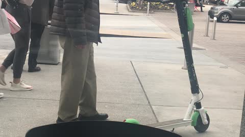 Man Bewildered By E-Scooter