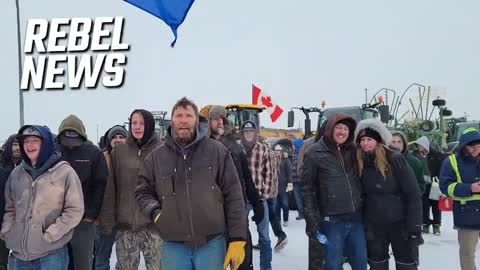 Truckers sing Canadian anthem as they stand their ground in face of threats